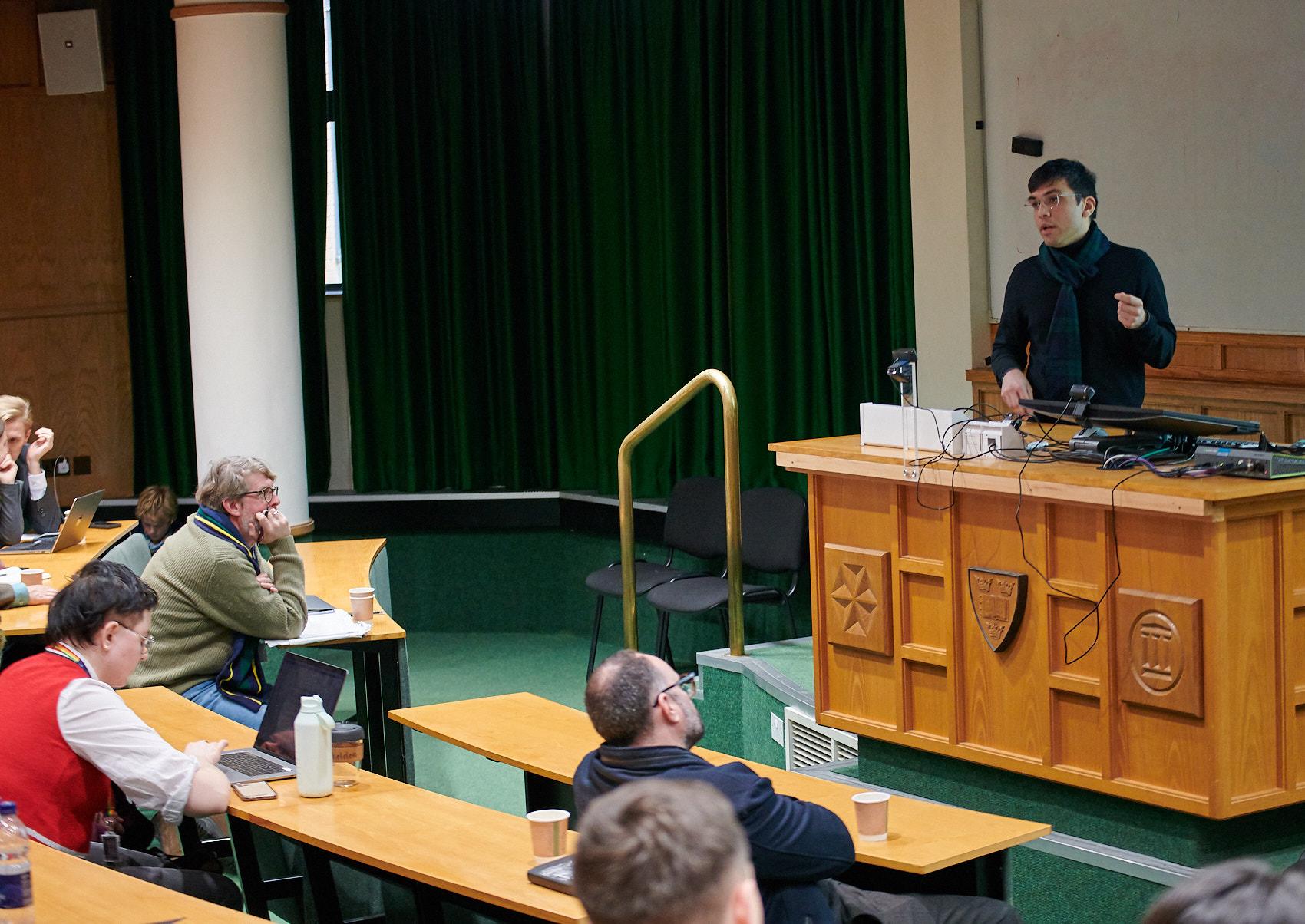 A photo of Abhinav Sharma presenting his research to Unit colleagues at Winter Science Day 2023.