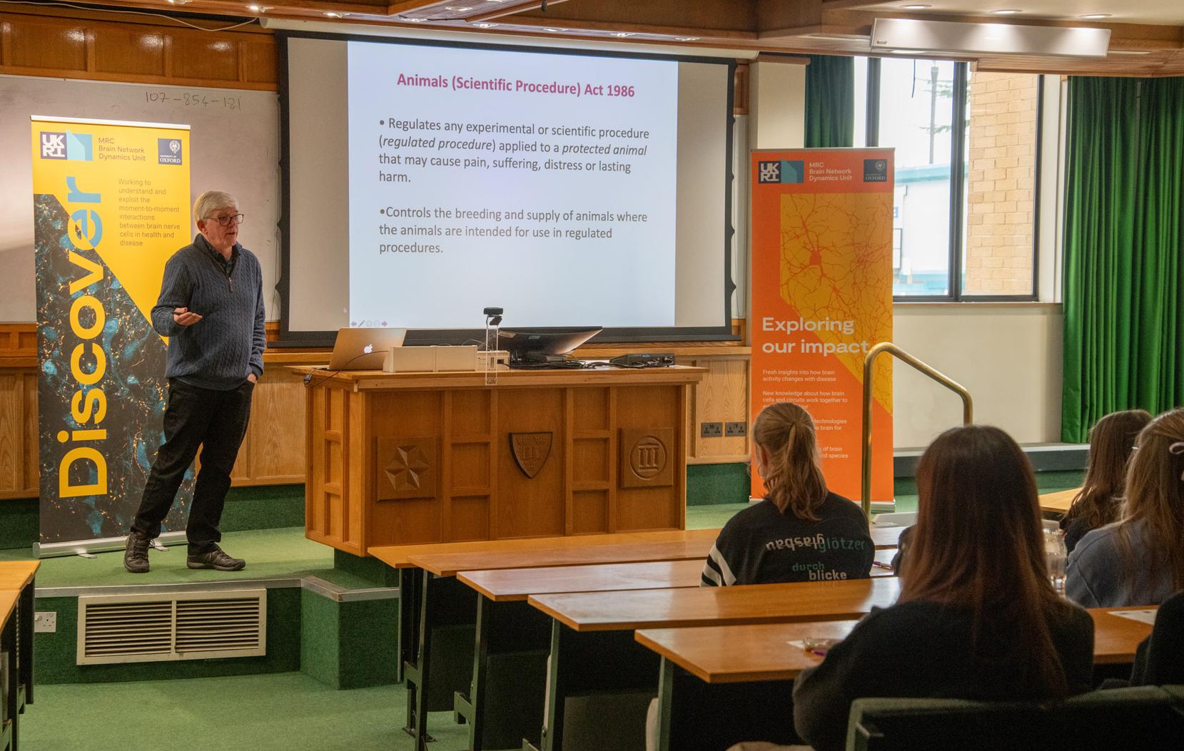 Photo of Paul Bolam speaking with school pupils visiting the Unit.