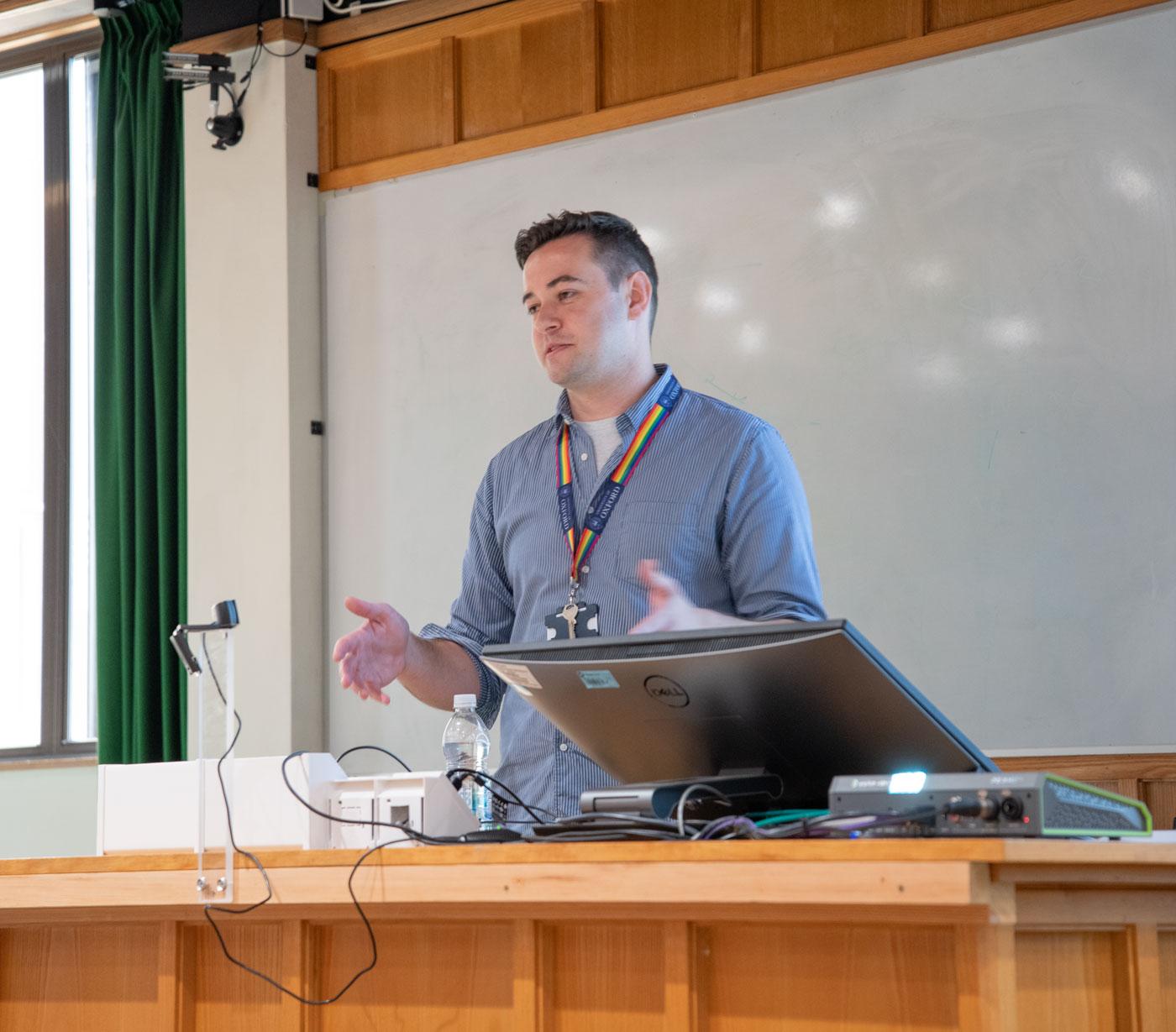 A photo of John Fleming presenting his research to Unit colleagues.