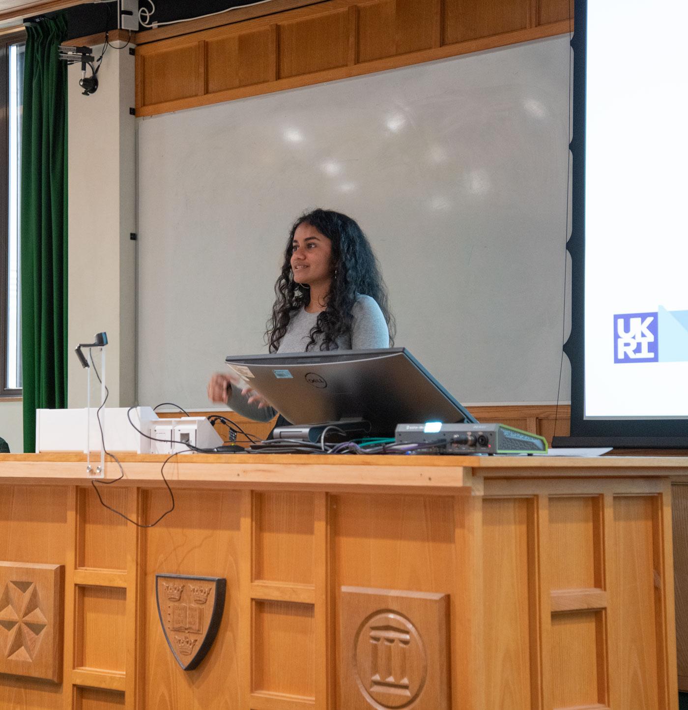 A photo of Sumedha Nalluru presenting her research to Unit colleagues.