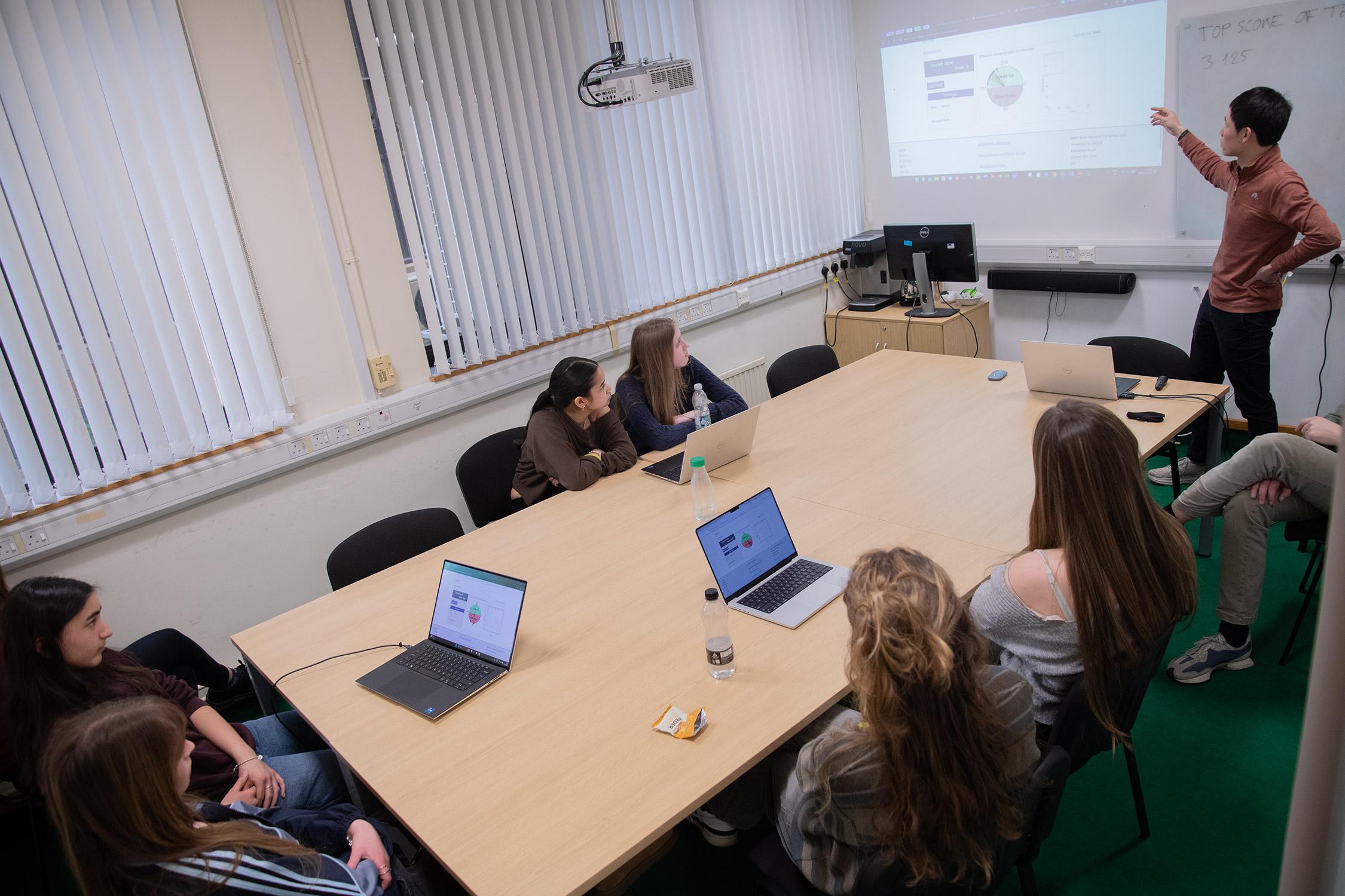 Photo of Yuhao Wang, together with school pupils visiting the MRC BNDU.